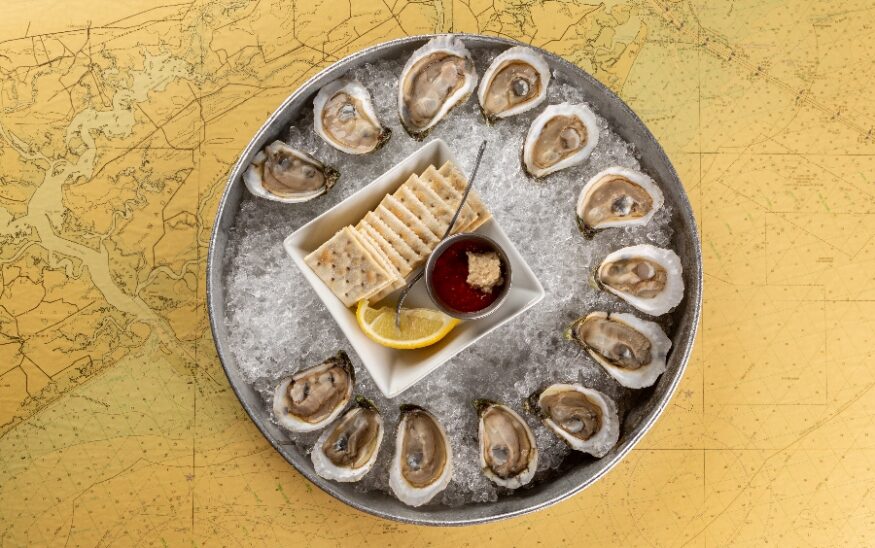 https://charlestonbusiness.com/wp-content/uploads/sites/4/2024/02/oysters-overhead-1-875x548.jpg